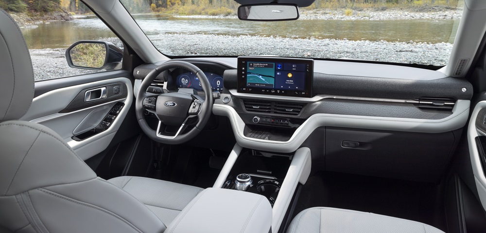 The dashboard and center console of a 2025 Ford Explorer Platinum with a Salt Crystal Gray interior