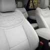 The front row of a 2025 Ford Explorer Platinum with Premium Sanctuary Leather seats in Salt Crystal Gray