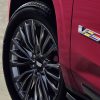 Close-up view of V-Series emblem on the front door of the 2024 Cadillac Escalade-V