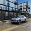 Front 3/4 view of a 2025 Chevrolet Equinox LT in Sterling Gray Metallic driving down a road Preproduction model shown. Actual production model may vary. Model year 2025 Chevrolet Equinox available 2024.