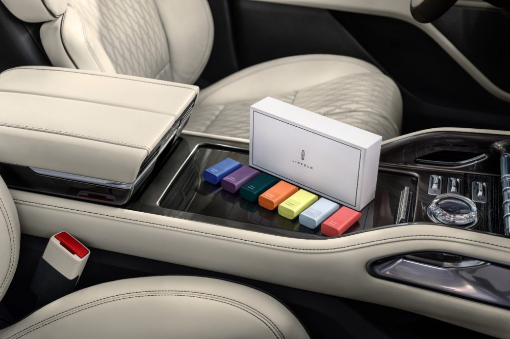 Lincoln Digital Scent hero shot with all seven cartridges sitting next to the center console of a 2024 Lincoln Nautilus