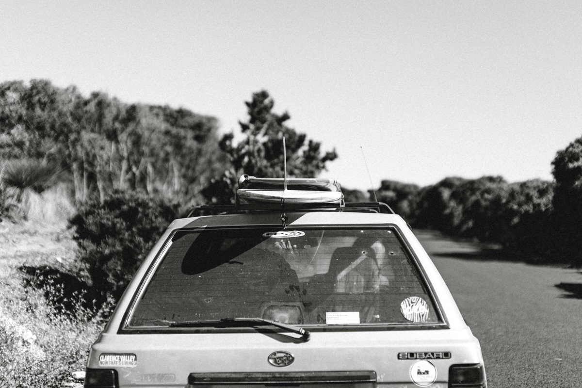 Old car with paddleboards