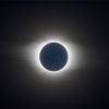 A photo of the moon fully covering the sun during a total solar eclipse