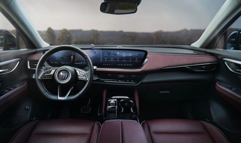 Interior view of the 2024 Buick Envision Sport Touring, including the steering wheel, windshield, dashboard, and 30-inch display screen