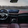 Interior view of the 2024 Buick Envision Sport Touring, including the steering wheel, windshield, dashboard, and 30-inch display screen