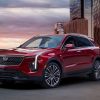 Exterior front 3/4 view of a red 2024 Cadillac XT4