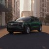 Exterior front 3/4 view of a green 2024 Cadillac XT4