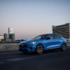 Action shot of a 2024 Ford Mustang Mach-E in Grabber Blue