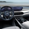 A view from the driver's seat of the 2025 Buick Enclave Avenir's steering wheel, dashboard, 30-inch screen display, and floating center console