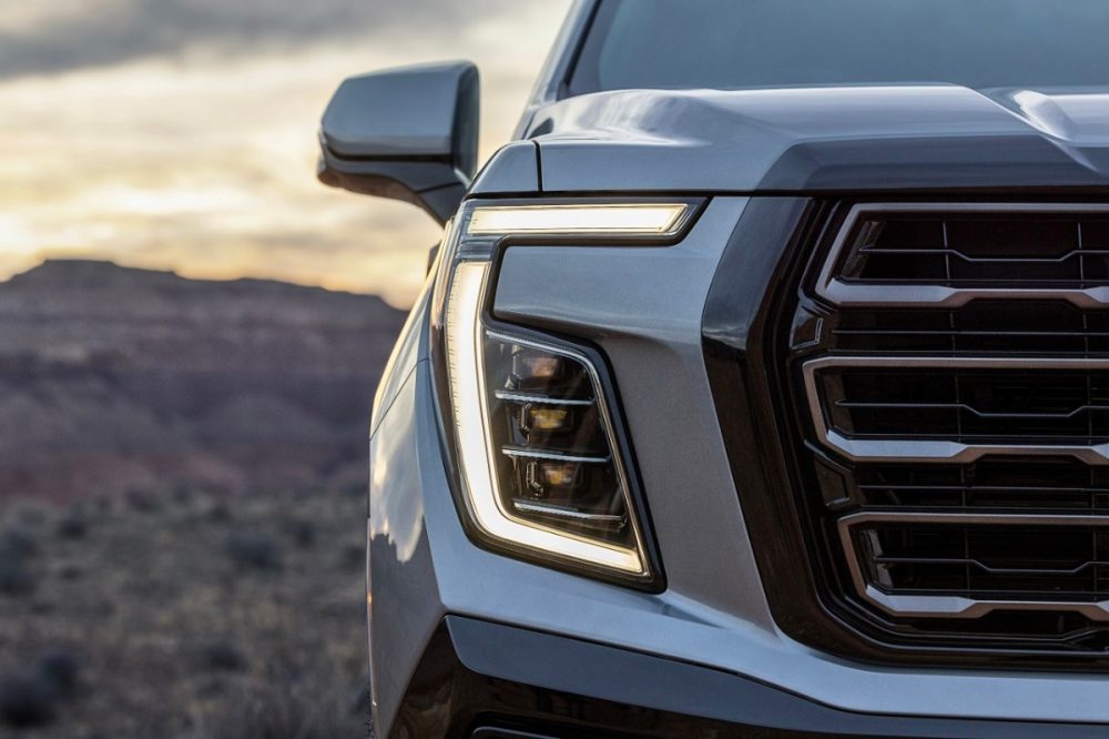 A close-up view of the 2025 GMC Yukon and its redesigned headlights, front fascia, and grille