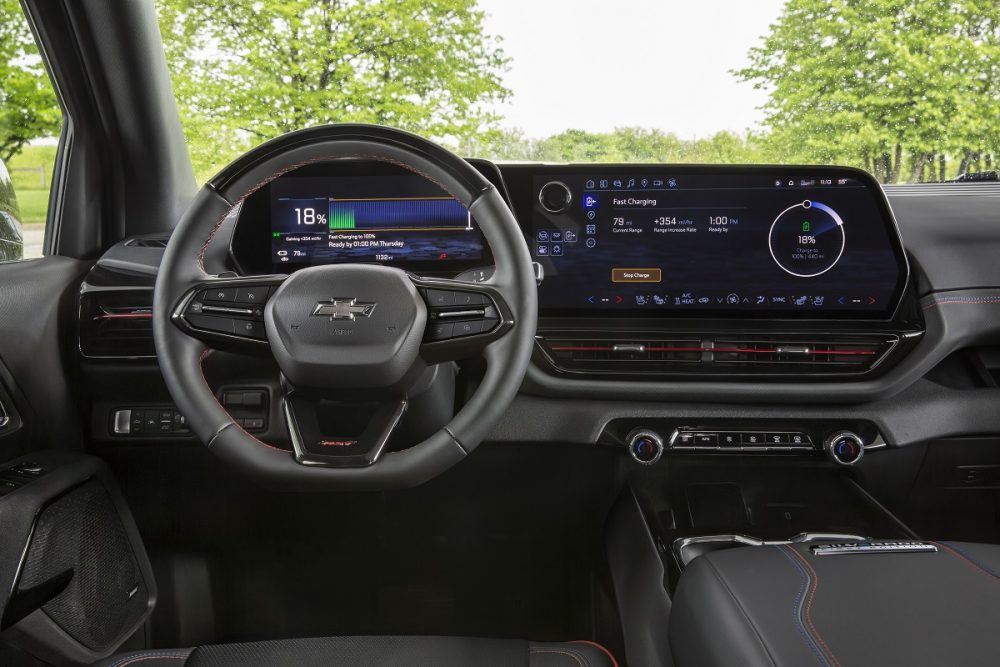 A driver’s view of the 2024 Chevrolet Silverado EV RST’s cockpit showing the driver information and infotainment screens