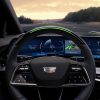 View of the 2025 Cadillac OPTIQ steering wheel with standard Super Cruise and steering wheel light bar activated.