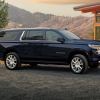 2024 Chevrolet Suburban parked in front of a mountain range