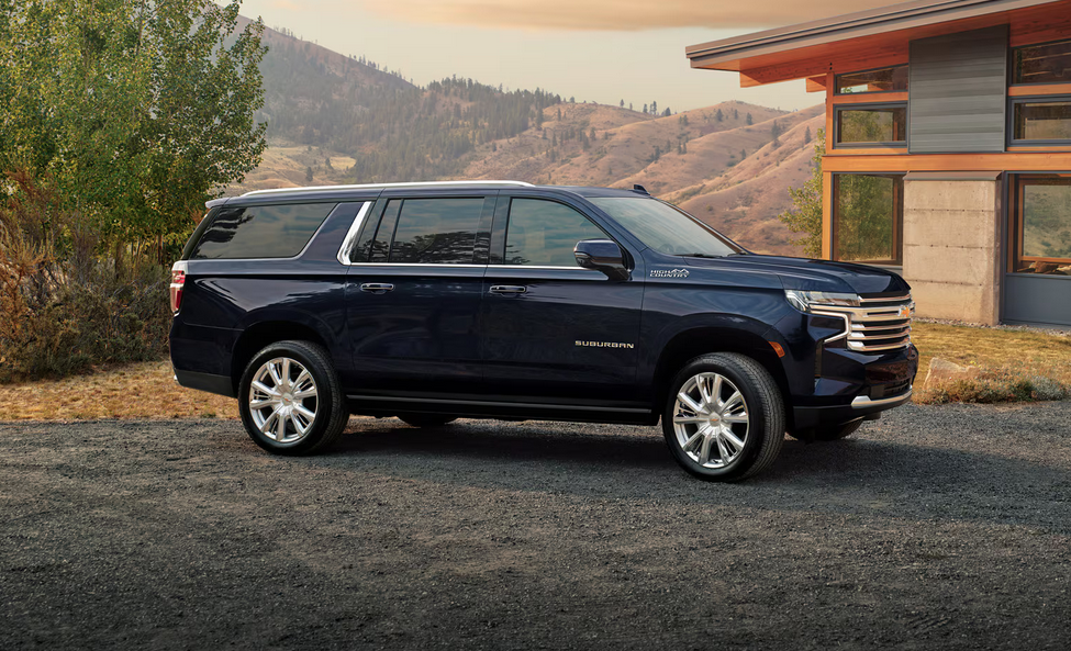 2024 Chevrolet Suburban parked in front of a mountain range