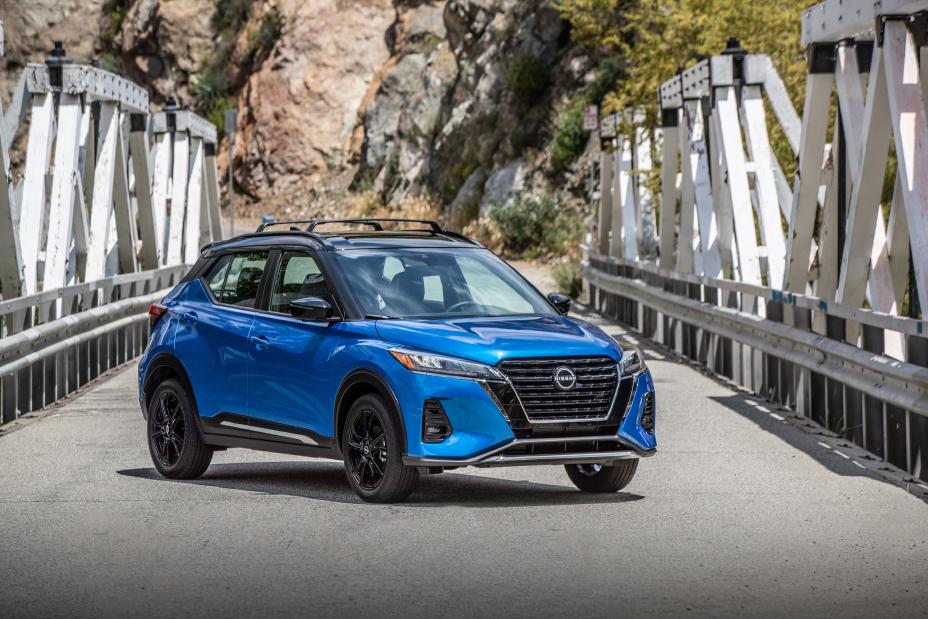 A Blue 2024 Nissan Kicks on a bridge