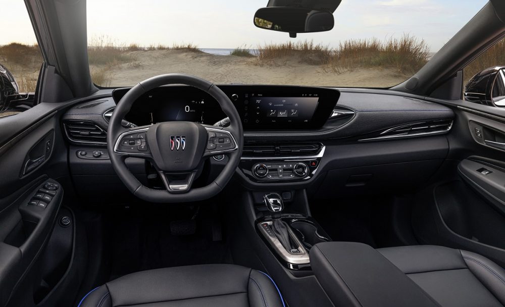 A view of the 2024 Buick Envista Sport Touring front row, including seats, steering wheel, and dashboard