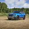 A blue 2025 Ford Bronco Sport sitting on a riverbed