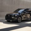 A front side view of a black 2025 Mazda CX-70 parked amid shadows