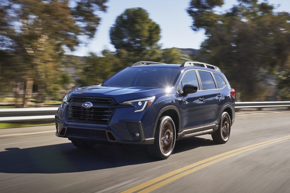 Front 3/4 view of the 2025 Subaru Ascent driving on a highway