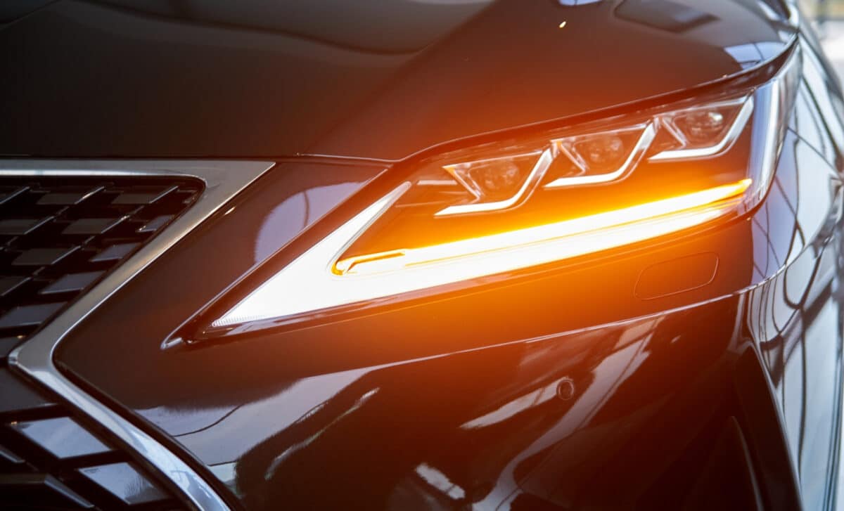 Bright spotlight on a new car in the showroom