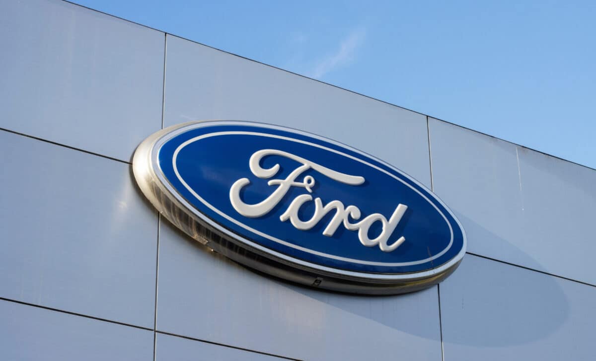 Close-up of the Ford logo seen in a dealership store