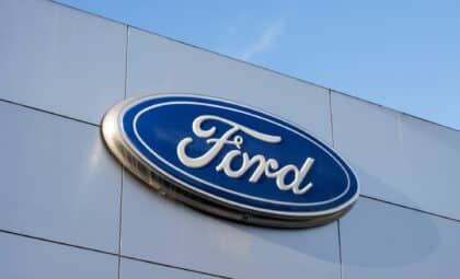 Close-up of the Ford logo seen in a dealership store