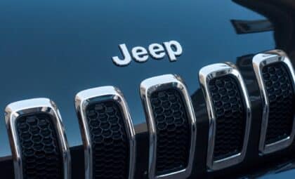 Closeup of Jeep logo on black car front