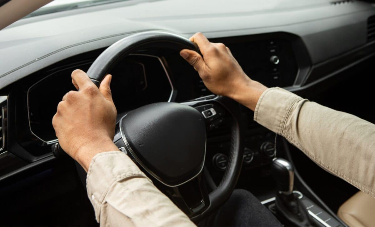 Hands on the car wheel