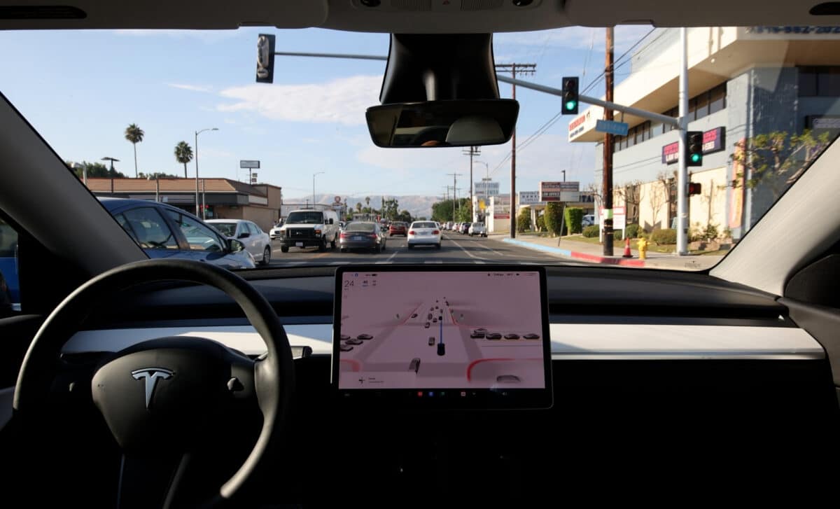 Tesla Model Y driven by the Full Self-Driving Beta in moderate traffic in a Los Angeles suburb