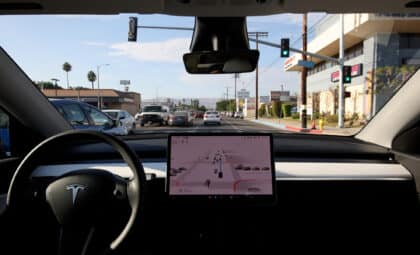 Tesla Model Y driven by the Full Self-Driving Beta in moderate traffic in a Los Angeles suburb