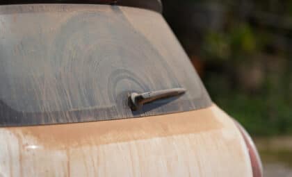 lots of red dust on the car rear mirror