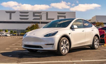 White Tesla in front of the factory